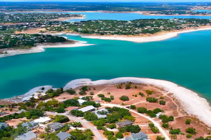 Aerial view of Canyon Lake's shoreline and surrounding homes, emphasizing the importance of location when searching for tips for finding the best Airbnbs near me.