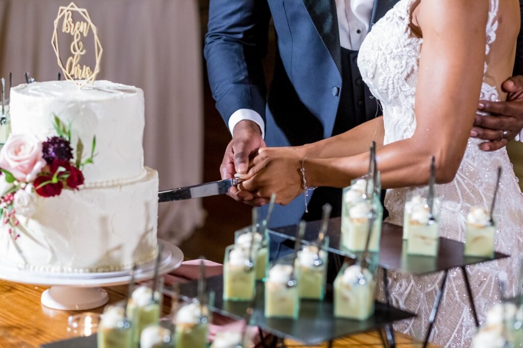 bride groom cutting wedding cake